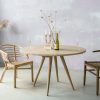 Minimalist boho style dining table with raw oak effect
