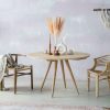 Minimalist boho style dining table with raw oak effect