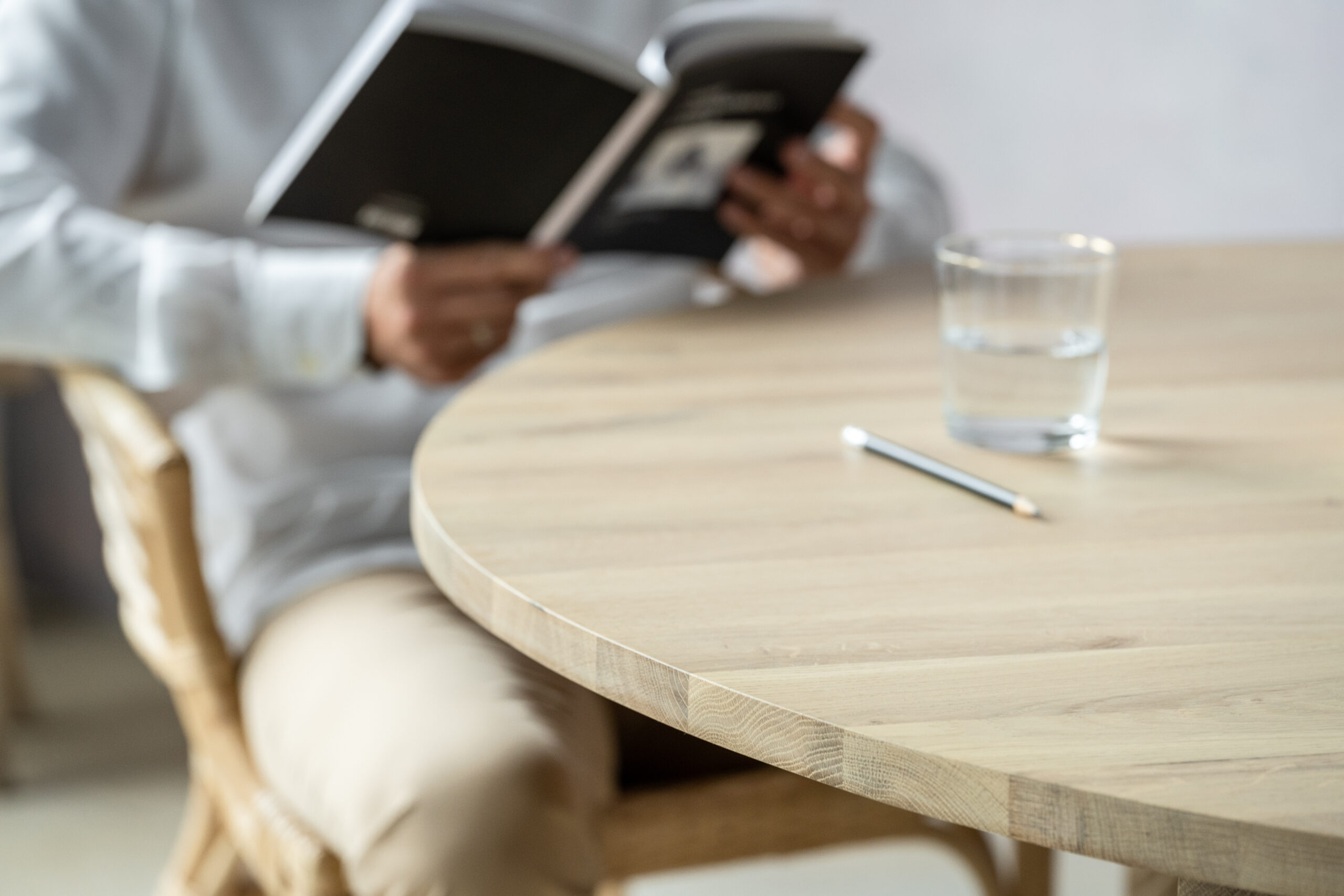 Minimalist boho style dining table with raw oak effect