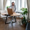 FJÄRIL LUMI custom round oak table Unique radial grain layout of Fjäril Lumi interacting with ambient lighting